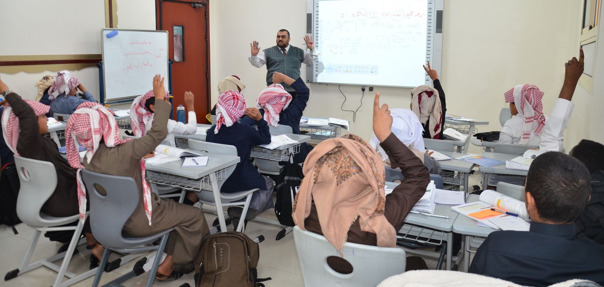 This Feb. 15, 2018, photo shows a group of Saudi students with their teacher.