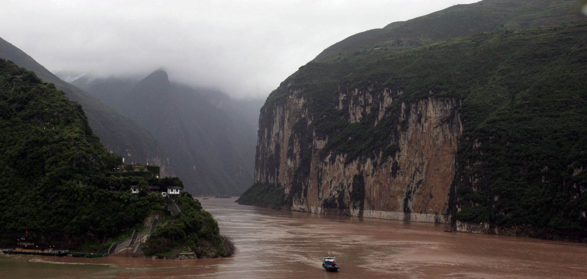 A boat sails at the Kuimen Gate of Qutang Gorge.