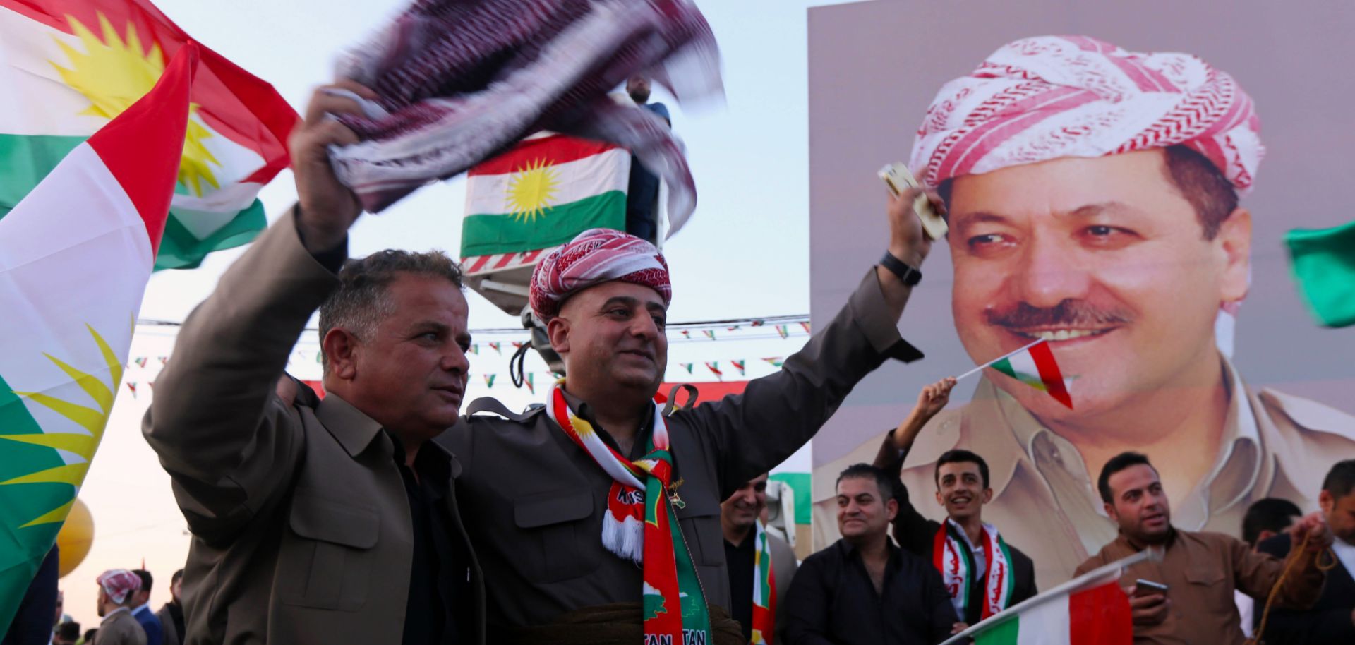 Iraqi Kurds gather in the streets of Arbil to urge people to vote in the upcoming independence referendum.