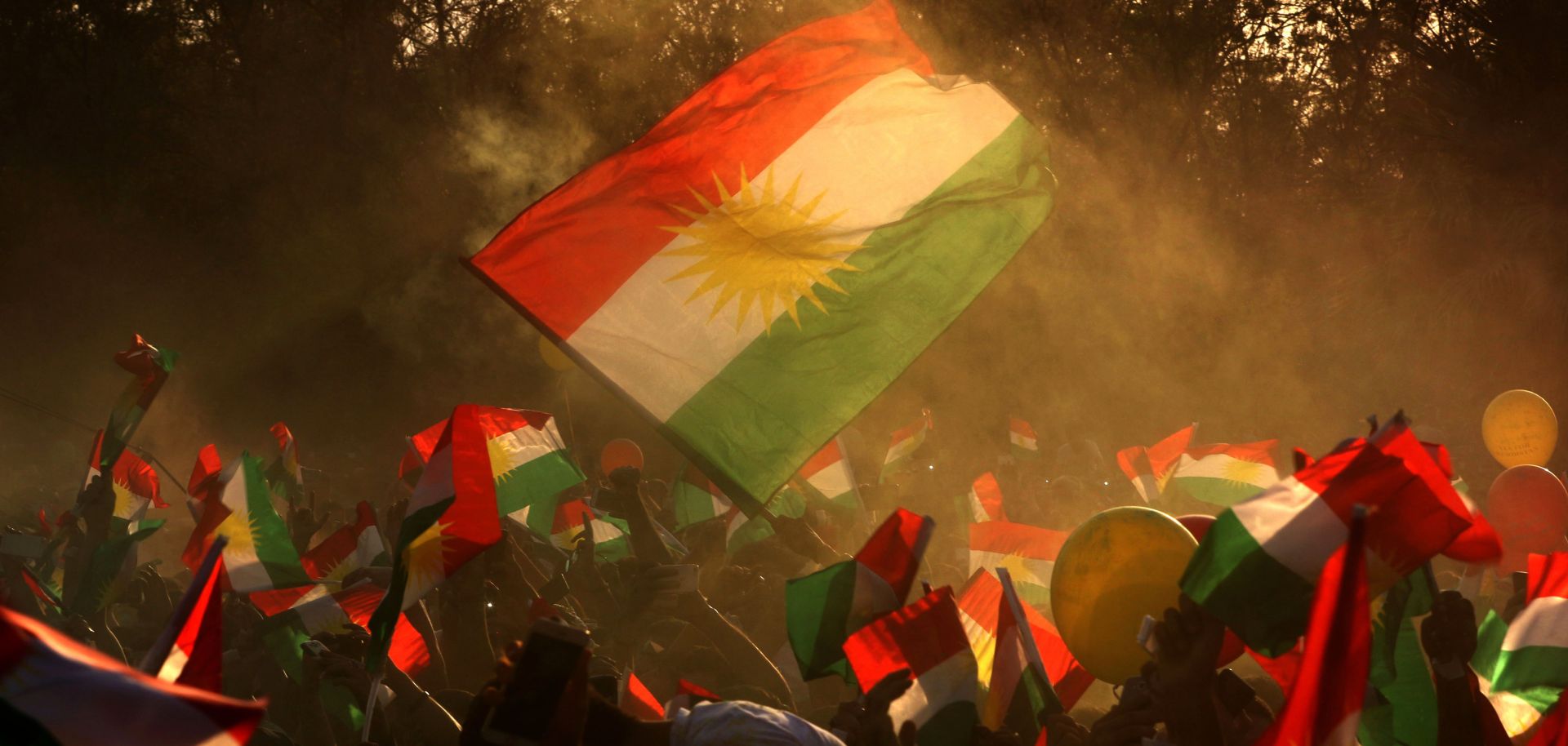 Iraqi Kurds fly Kurdish flags in Arbil on Sept. 15.