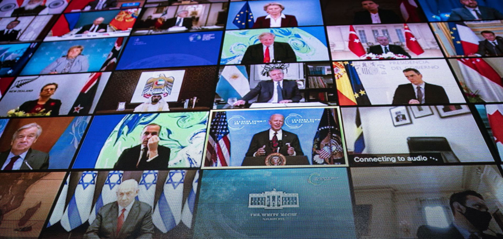 World leaders are seen on a screen as U.S. President Joe Biden delivers remarks during a virtual climate summit on April 22, 2021. 
