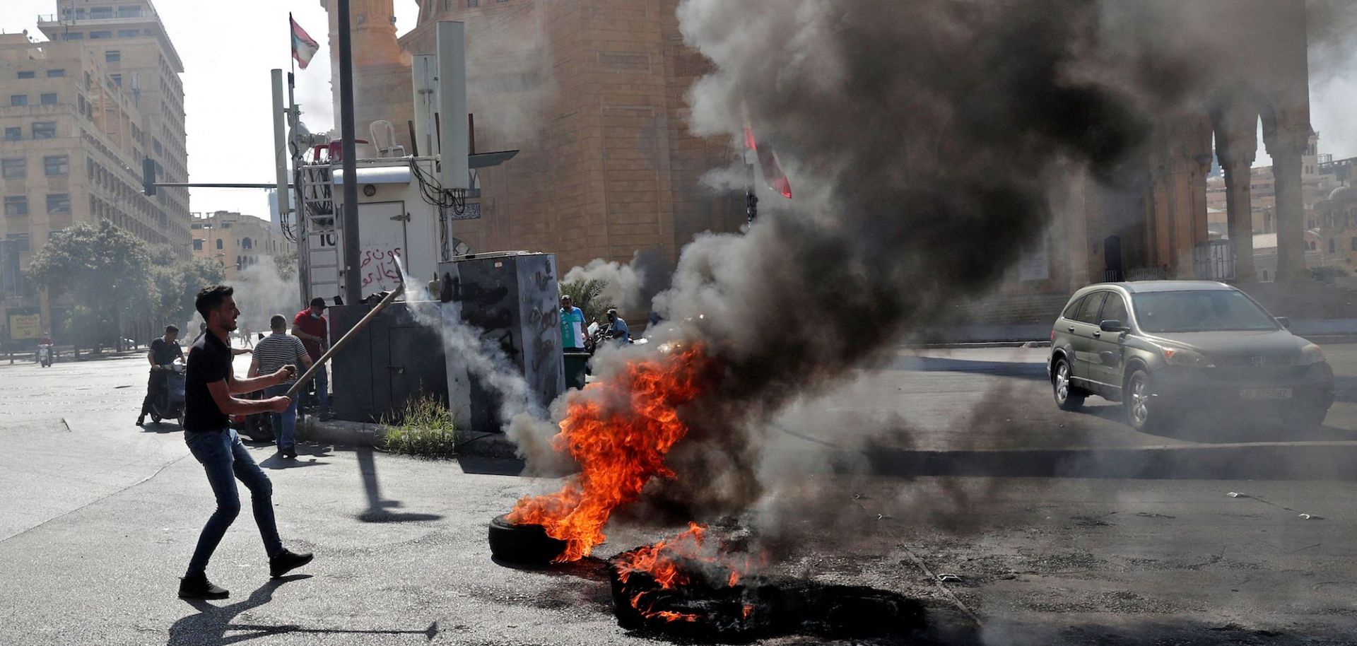 Demonstrators burn tires in Lebanon's capital of Beirut on June 26, 2021, in protest of the country’s ongoing economical and political crisis. 