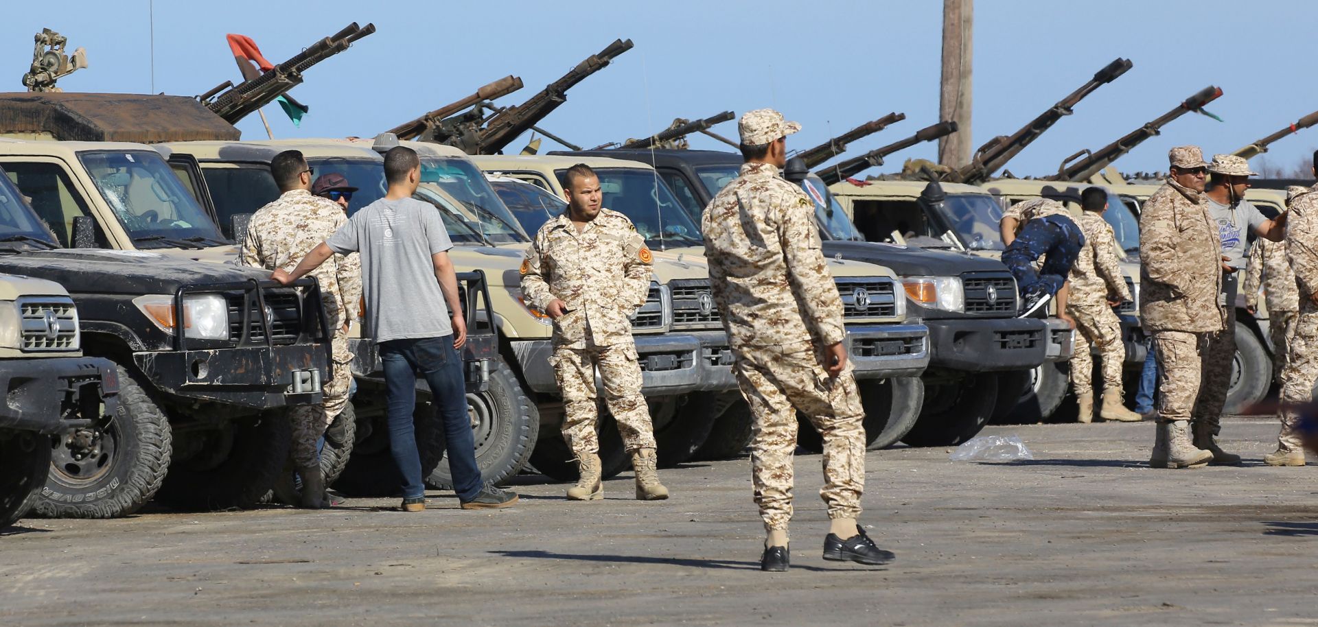 Militia members from Misrata, who support Libya's Government of National Accord, arrive in a Tripoli suburb on April 6, 2019, ready to defend the capital from an assault by the Libyan National Army, led by Field Marshal Khalifa Hifter.