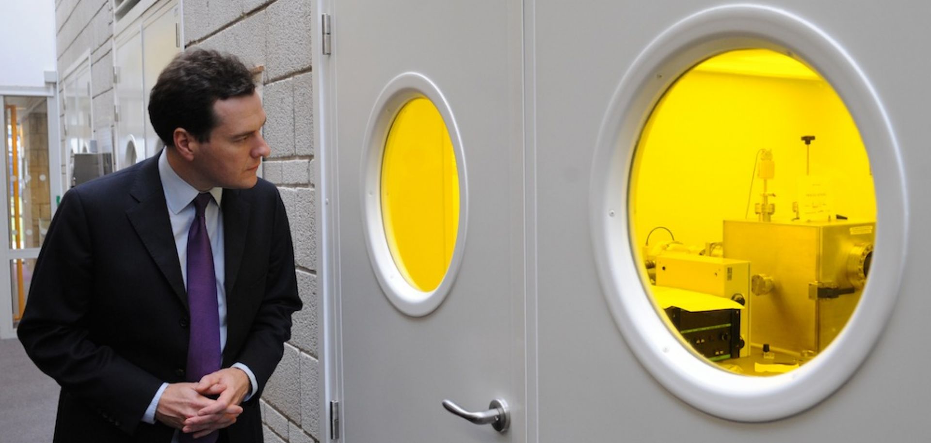 British Chancellor of the Exchequer George Osborne tours labs at the University of Manchester on Oct. 3, 2011, and observes research into the use of graphene.