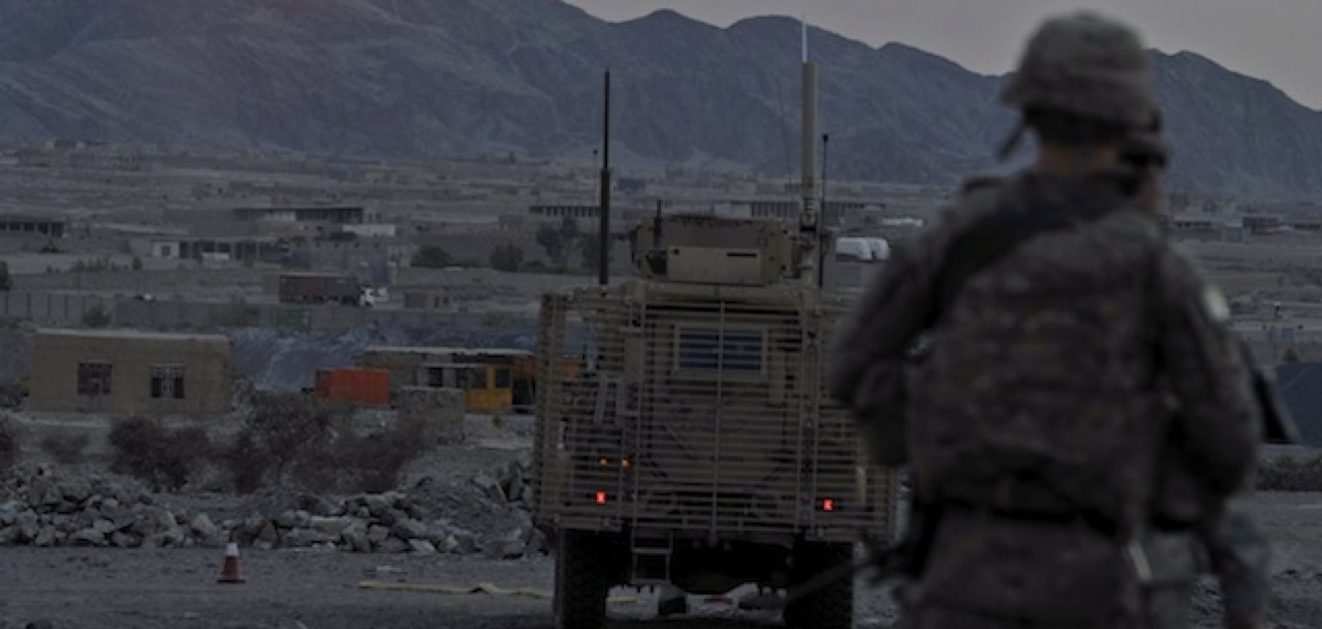 A U.S. soldier watches the sun go down near Turkham, Afghanistan.