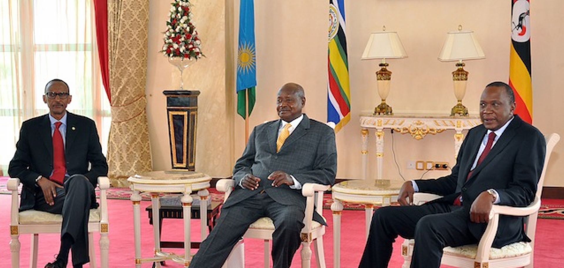 Rwandan President Paul Kagame (L), Ugandan President Yoweri Museveni (C) and Kenyan President Uhuru Kenyatta meet June 25 in Entebbe, Uganda.