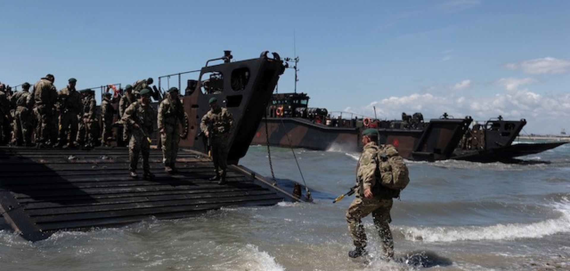 British Royal Marines demonstrate a beach landing during D-Day commemorations in Portsmouth on June 5, 2014. Seventy years after the largest seaborne invasion in history, technology has changed the way that invaders would conduct amphibious operations.