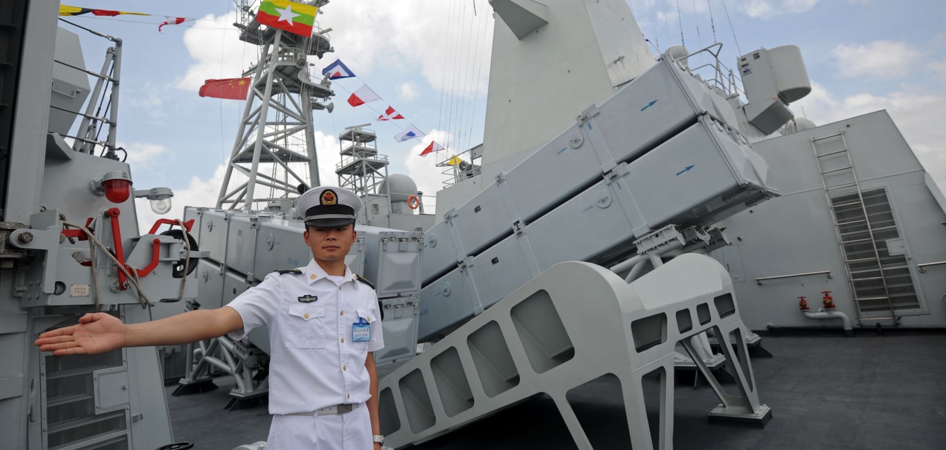 A crew member stands guard on the deck of the Chinese People's Liberation Army Navy ship Wei Fang, docked at the Myanmar International Terminal Thilawa port on the outskirts of Yangon on May 23.