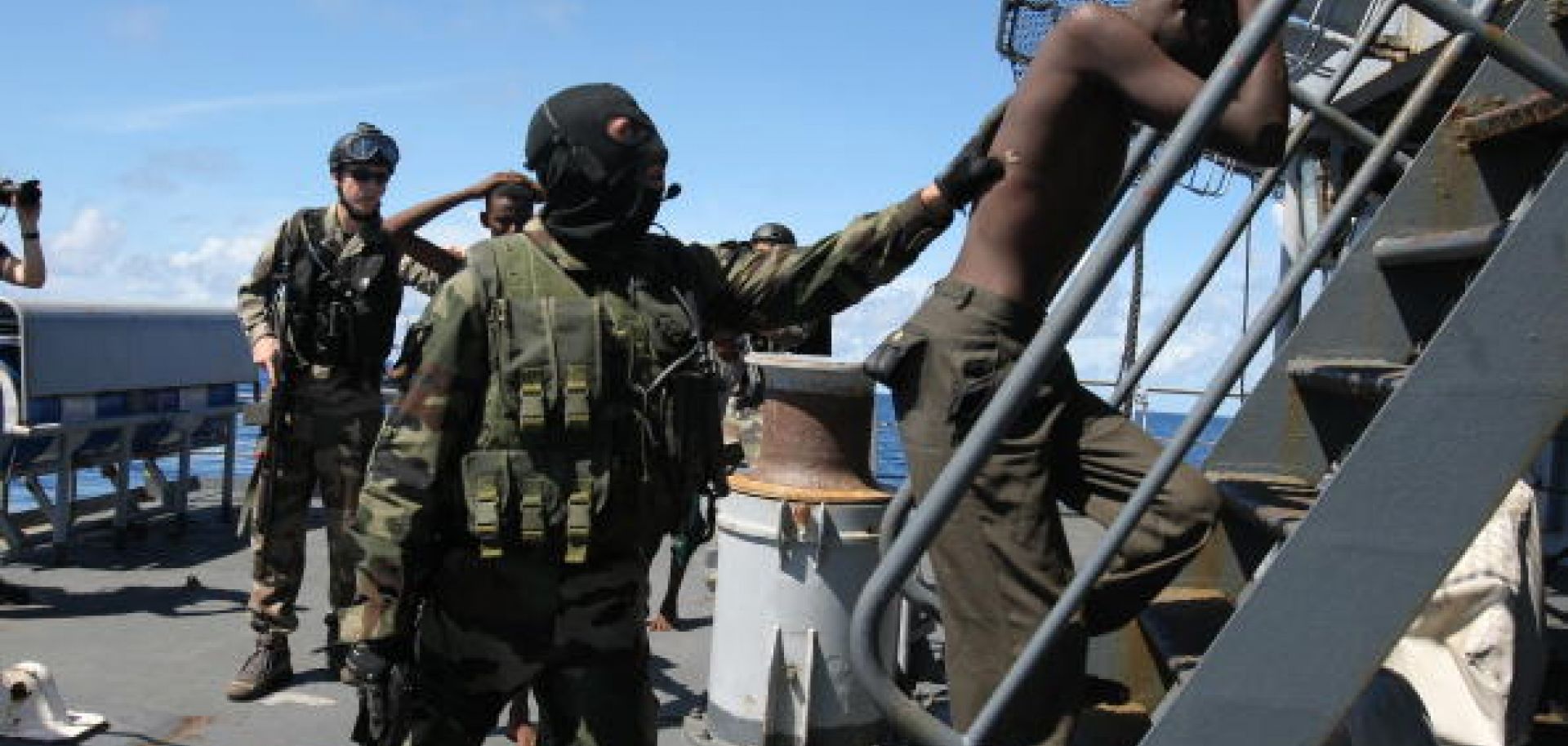 A French serviceman detaining a suspected Somali pirate on the French frigate Le Nivose in May 2009. 
