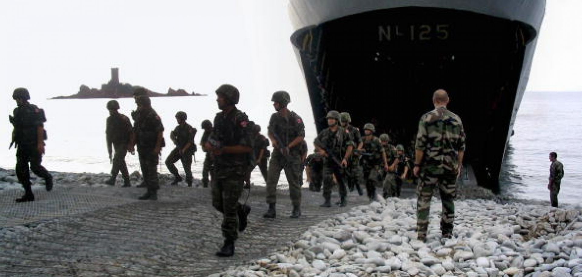Turkish troops exit a landing ship during a training exercise in France
