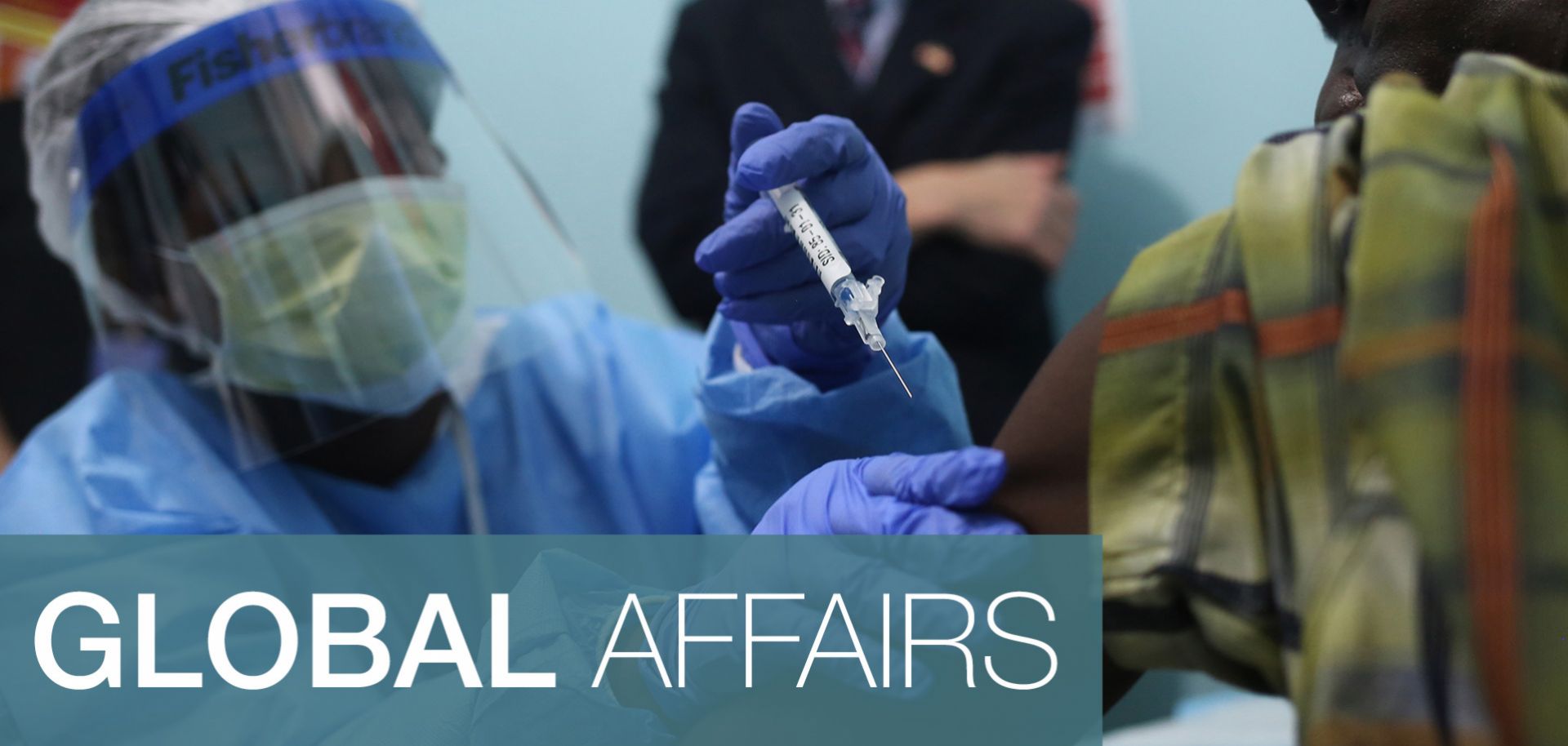 A nurse administers a trial vaccine during the first day of an Ebola vaccine study in Monrovia.