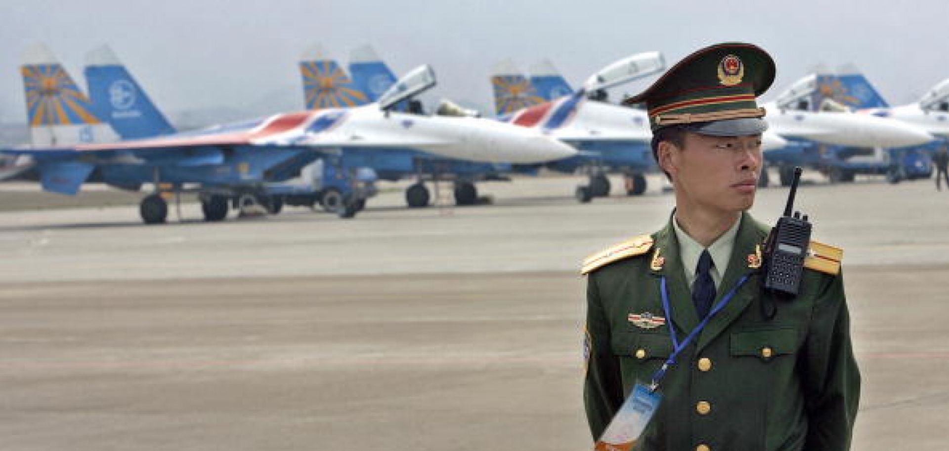 A Chinese officer stands guard before a row of Russian Su-27 'Flankers'. Negotiations over the sale of Russian navy fighter jets to China have broken down. The dispute actually represents a much larger issue -- China's growing expertise at reverse-engineering and copying Russia's military hardware.
