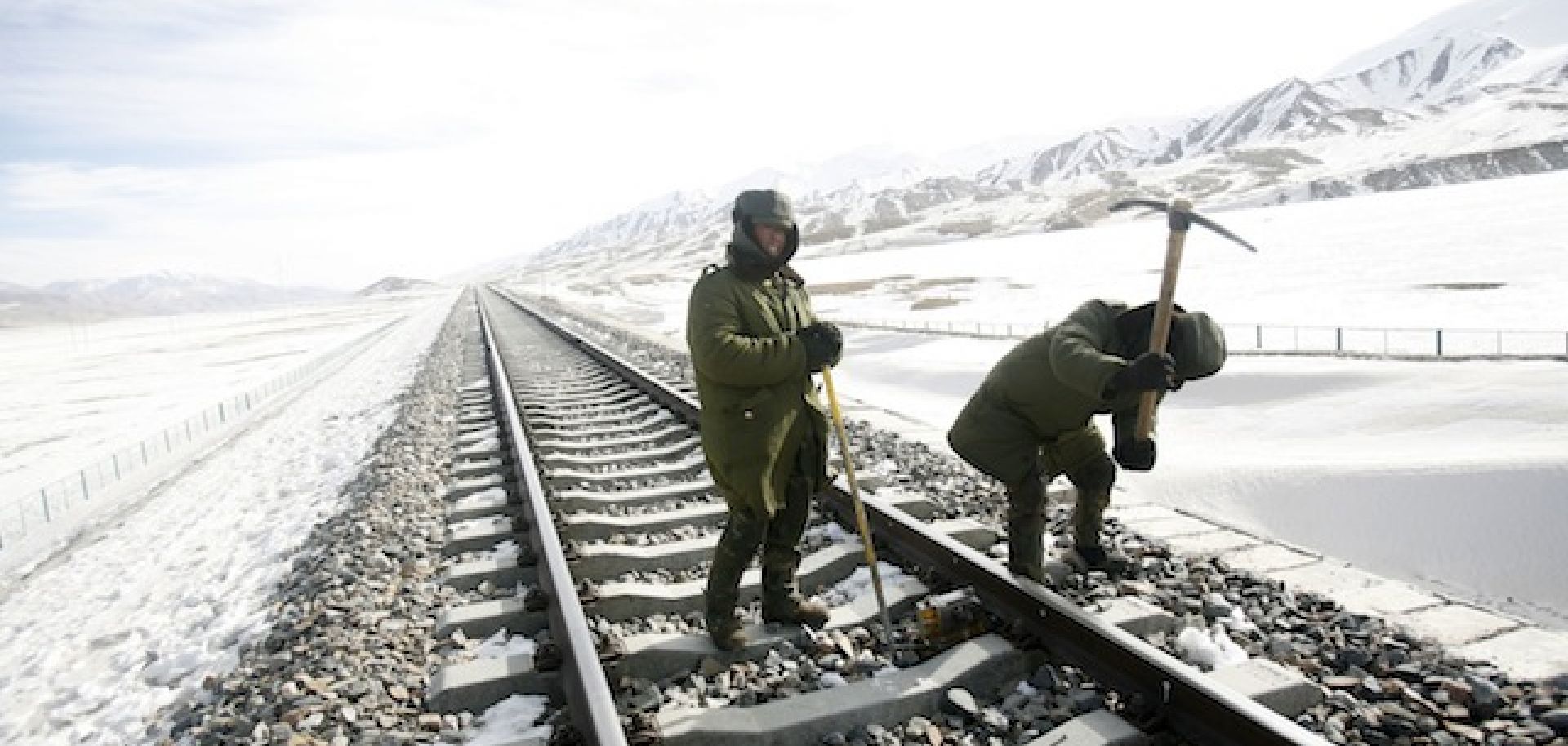 Workers carry out track maintenance along a segment of the Qinghai-Tibet railway