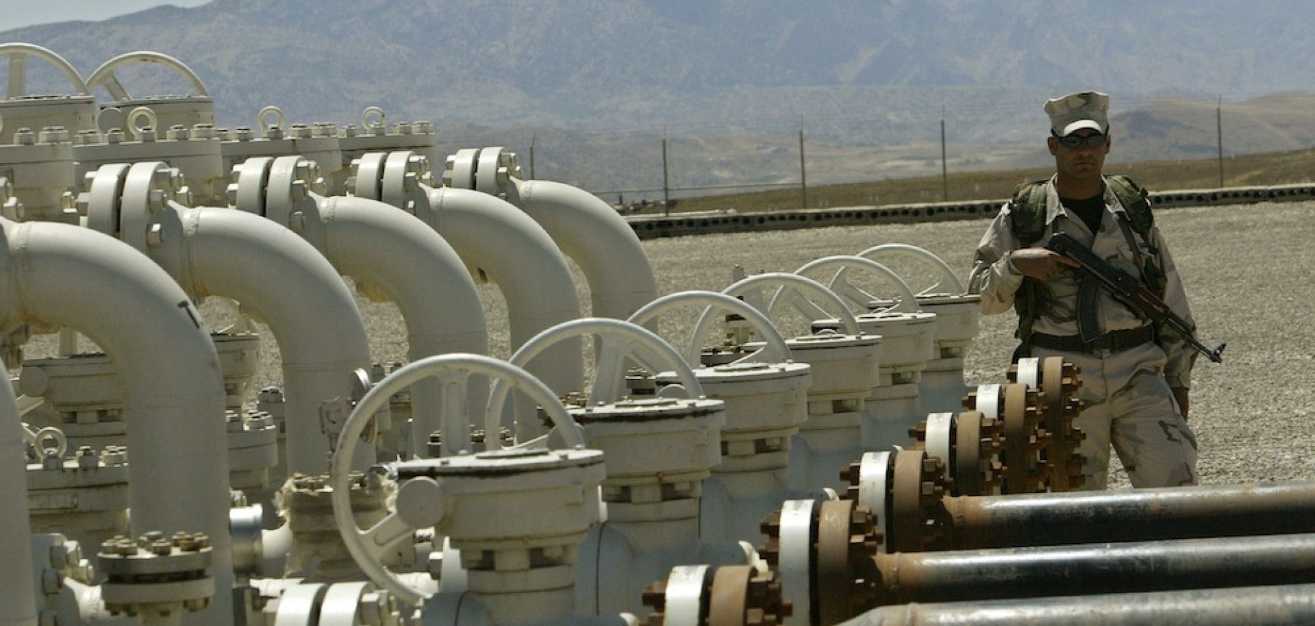 An Iraqi Kurdish soldier stands guard at the Tawke oil field near the town of Zacho in Dohuk province.