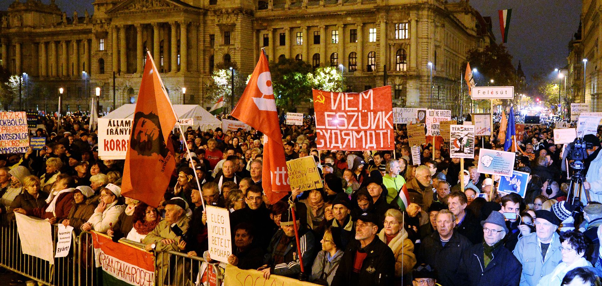 Protesters hold flags and placards during a rally in front of the parliament building in Budapest on Nov.17. 