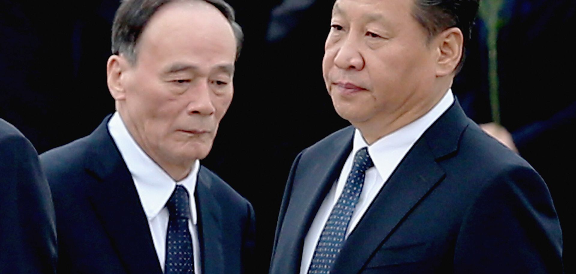 Chinese President Xi Jinping and Secretary of the Central Commission for Discipline Inspection Wang Qishan arrive at the Monument of People's Heroes on September 30, 2014.
