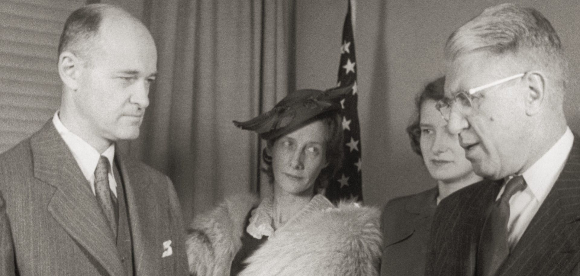 U.S. diplomat and historian George F. Kennan (1904 - 2005, left) is sworn in as ambassador to the Soviet Union by Raymond Muir, as Kennan's wife and daughter look on.
