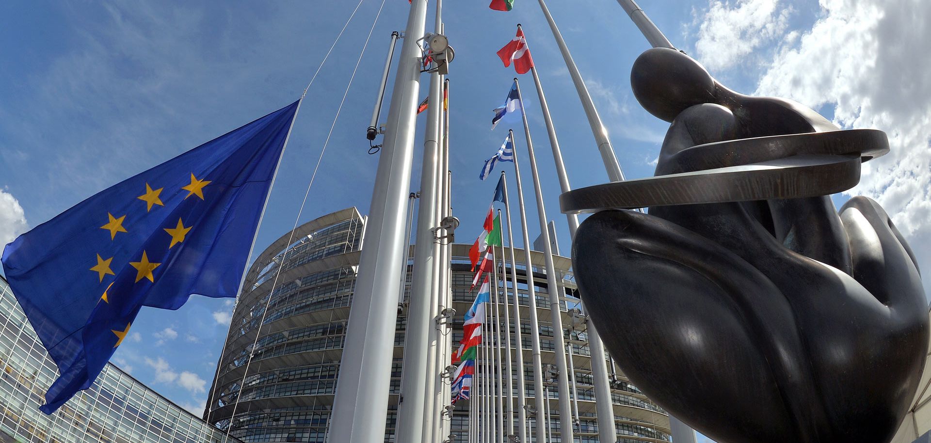 The European Union flag flying in front of the European Parliament in Strasbourg, France.