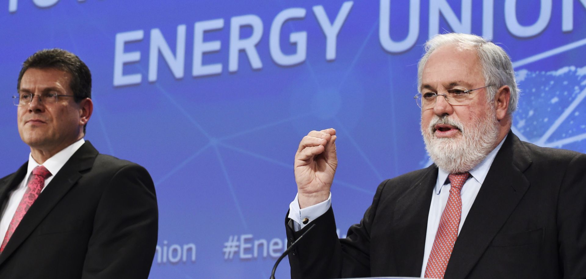 EU Commissioner of Climate Action and Energy Miguel Arias Canete (R) and EU Commissioner for Energy Union Maros Sefcovic (L) speak at EU headquarters in Brussels on Feb. 25.