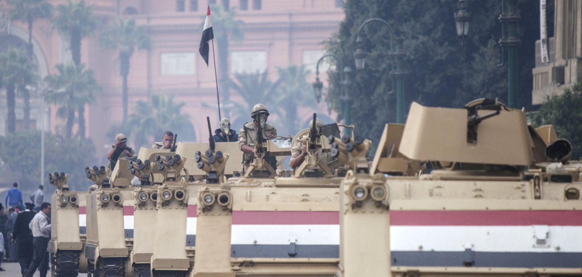 Egyptian military M113 armored personnel carriers arrive at Cairo’s Tahrir Square on Dec. 1, 2013 after dispersing Cairo University students rallying for ousted President Mohamed Morsi. (MAHMOUD KHALED/AFP/Getty Images)