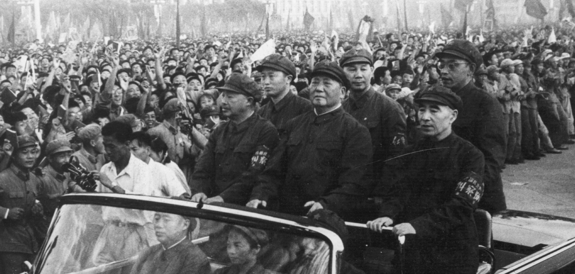 Chinese leader Mao Zedong accompanied by second-in-command Lin Biao passes through a 1966 Tiananmen Square rally.