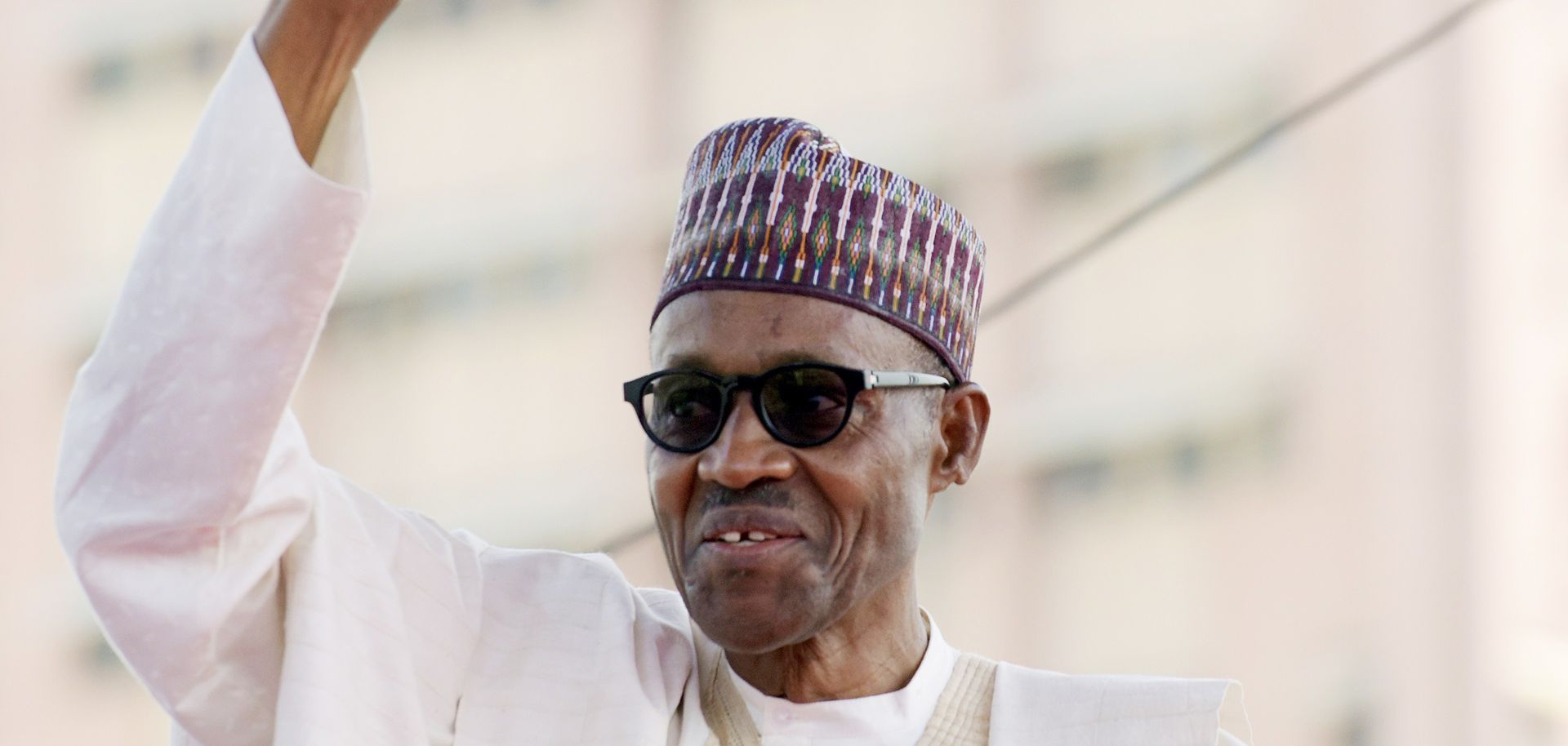 Nigerian President Muhammadu Buhari raises his fist to greet the crowd before taking an oath of office at the Eagles Square in Abuja on May 29.