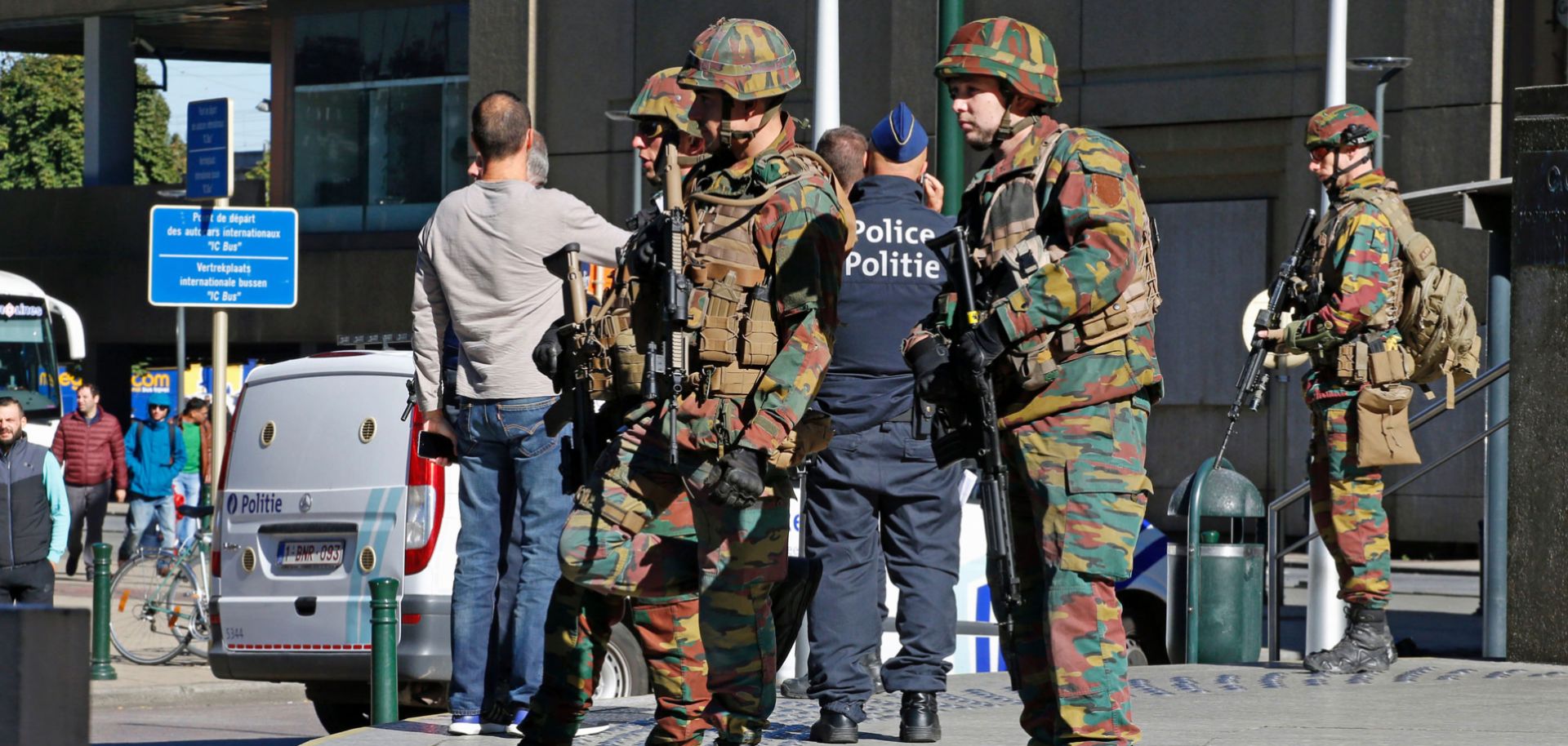Police and army personnel on guard during a bomb alert outside the Brussels-North train station, Oct. 5.