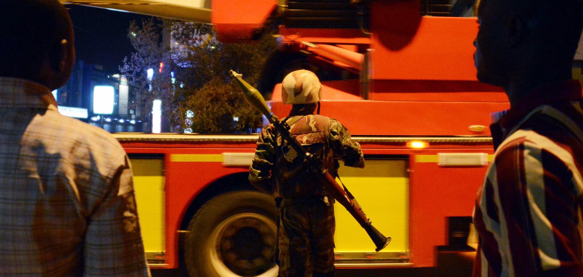 A soldier stands near Burkina Faso’s Hotel Splendid where gunmen from al Qaeda in the Islamic Maghreb attacked Jan. 15. (AHMED OUOBA/AFP/Getty Images)