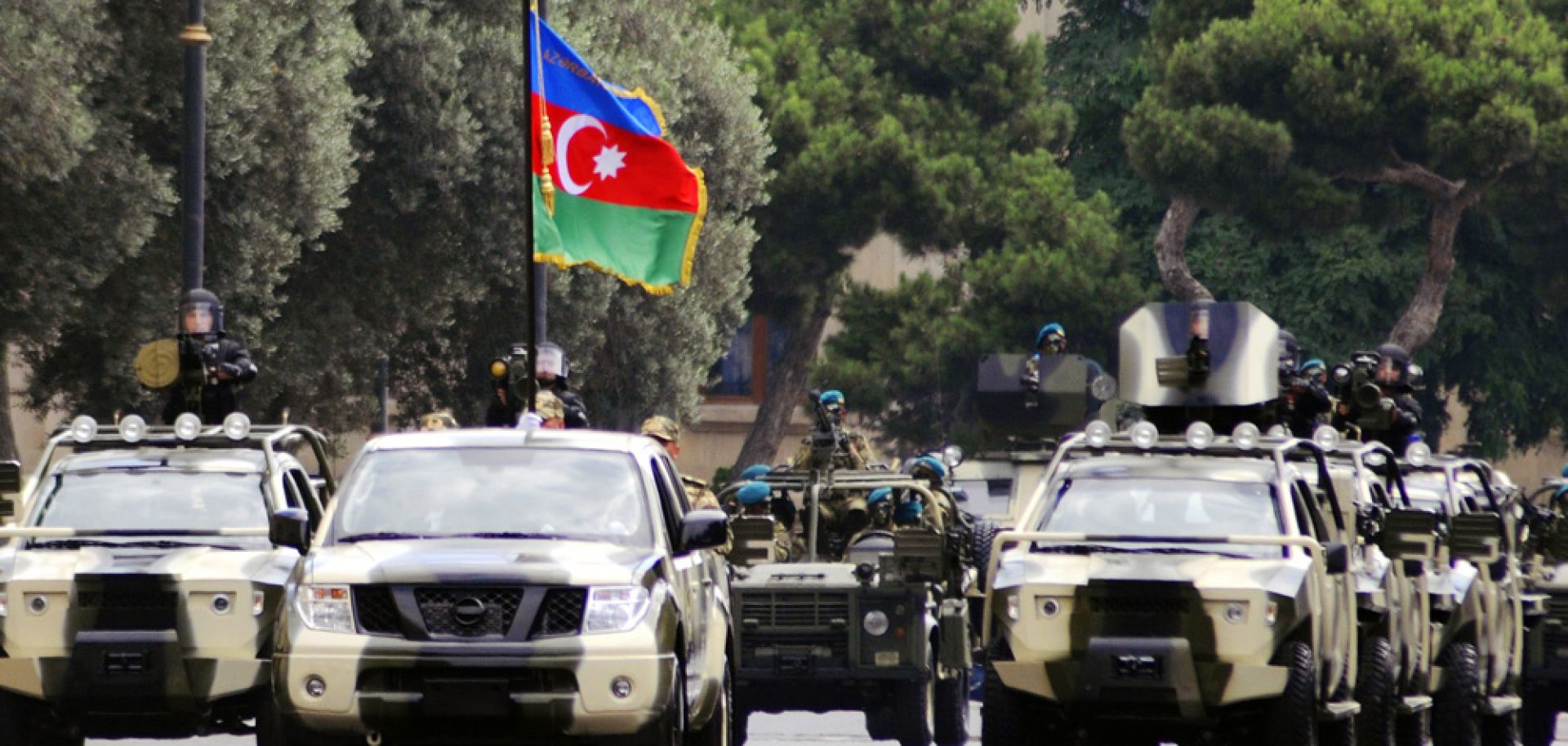 Military vehicles participate in a parade in Baku on June 26, 2013.