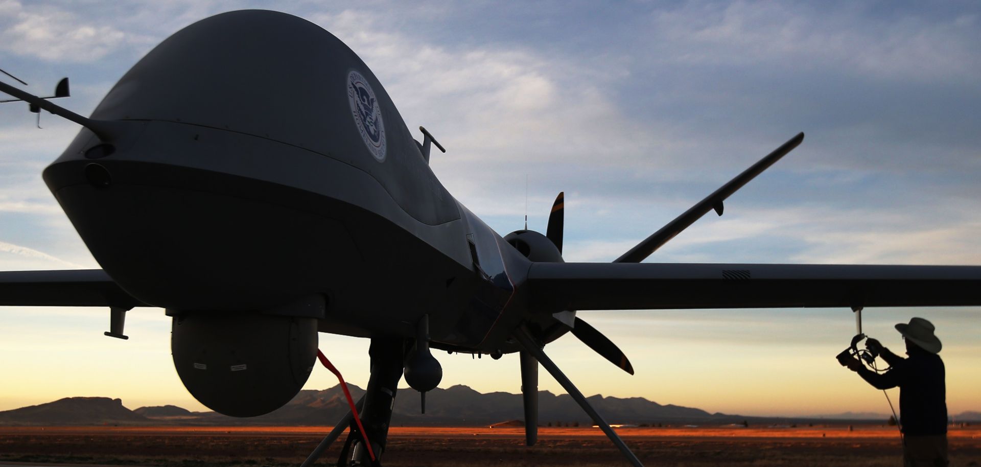 U.S. maintenance personnel check a Predator drone before a surveillance flight near the Mexican border.