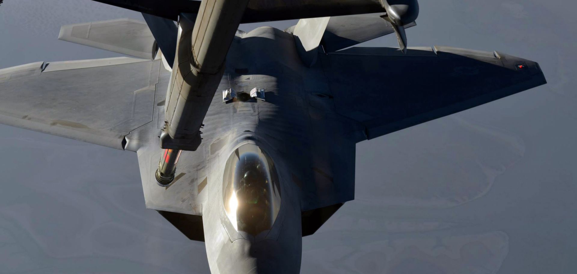 An F-22 Raptor fighter aircraft refuels prior to strike operations against the Islamic State in Syria. Such missions will be more cautious after the U.S. missile strike on a Syrian air base.