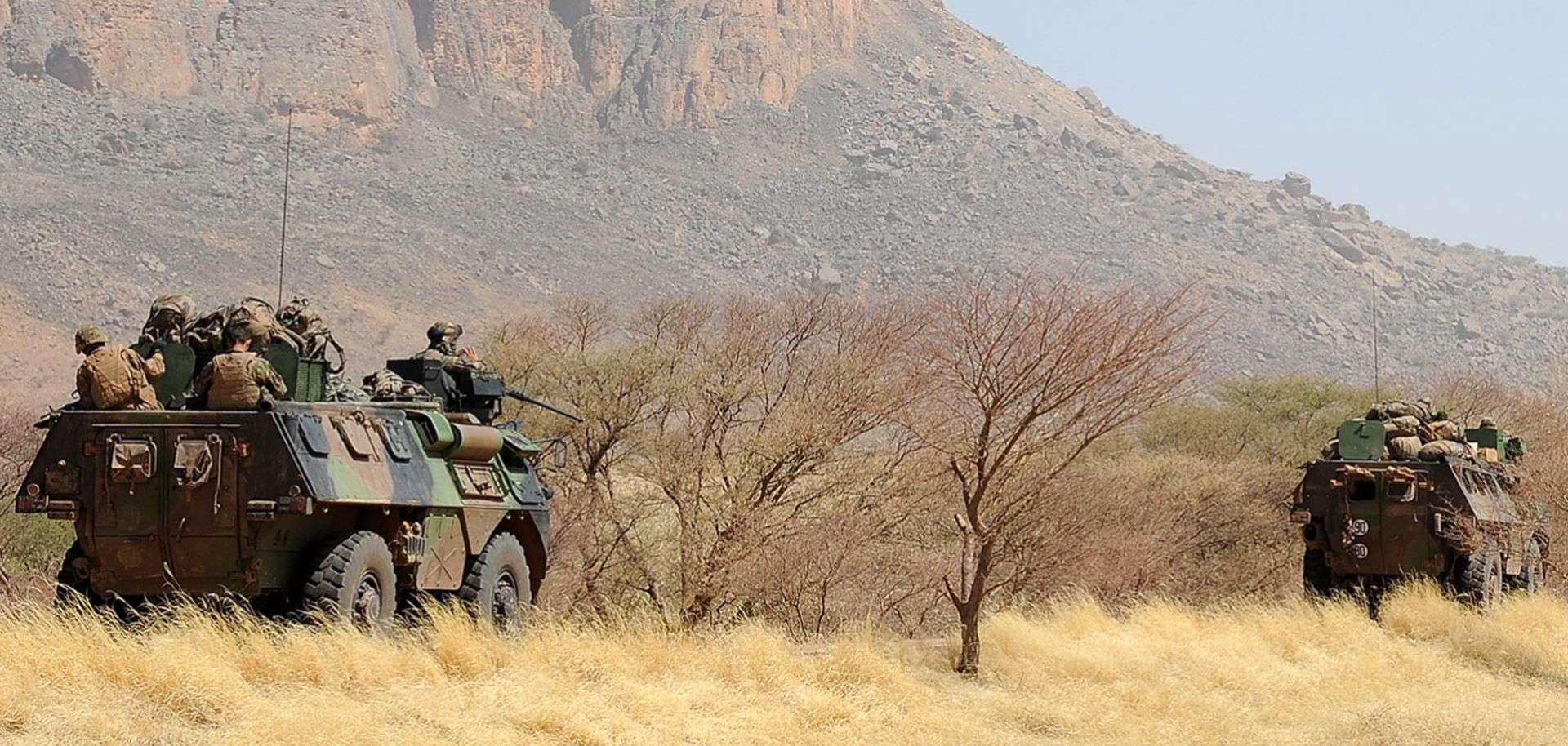 A convoy of French army vehicles heads toward Gao on February 7, 2013, on the road from Gossi after four Malian civilians were killed by a landmine in territory reclaimed from Islamist rebels. 