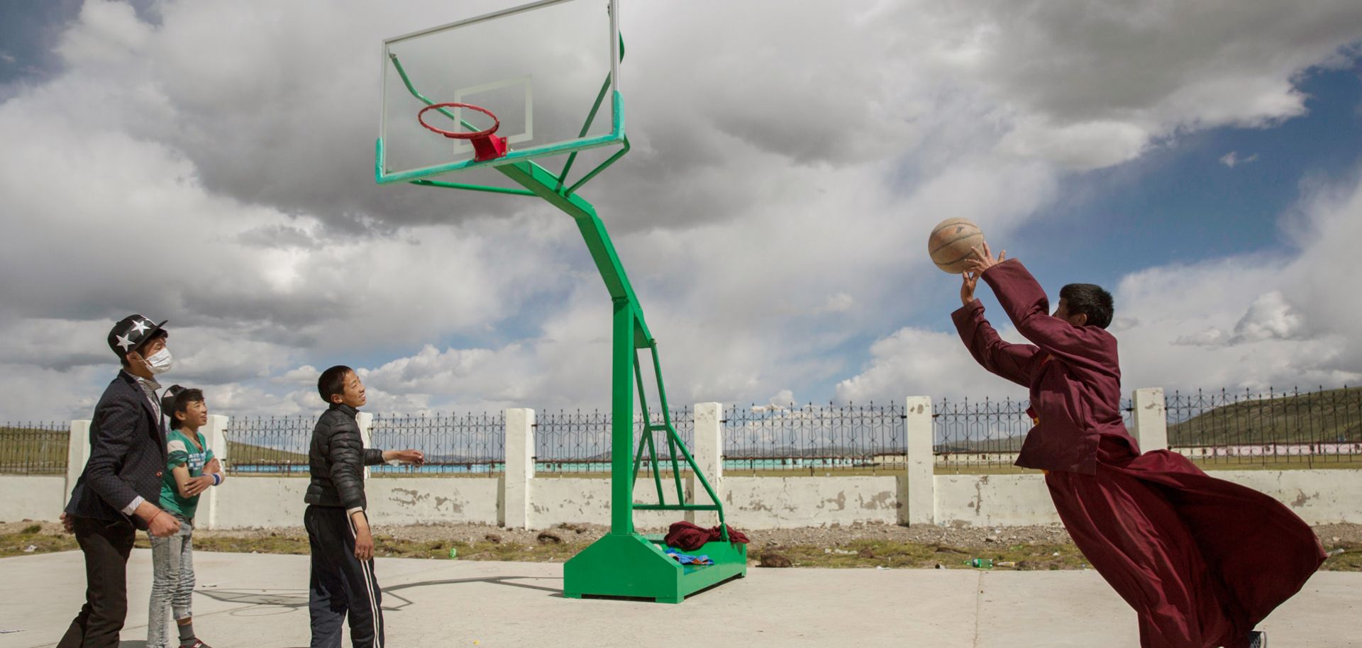A Tibetan monk plays basketball on the Tibetan Plateau in Qinghai, China. Some 300 million Chinese -- close to the population of the entire United States -- regularly play basketball.