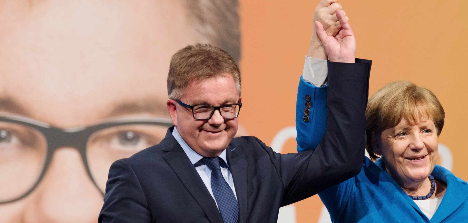 German Chancellor Angela Merkel and Guido Wolf (L), top candidate of the Christian Democratic Union (CDU) for the state elections in the southwestern German federal state of Baden-Wuerttemberg, attend an election campaign event in Nuertingen, southwestern Germany, on March 8, 2016. Chancellor Angela Merkel's party risks a drubbing at key state elections on March 13, 2016 as voters punish the German leader for her liberal refugee policy, while the right-wing populist AfD eyes major gains as it scoops up the 