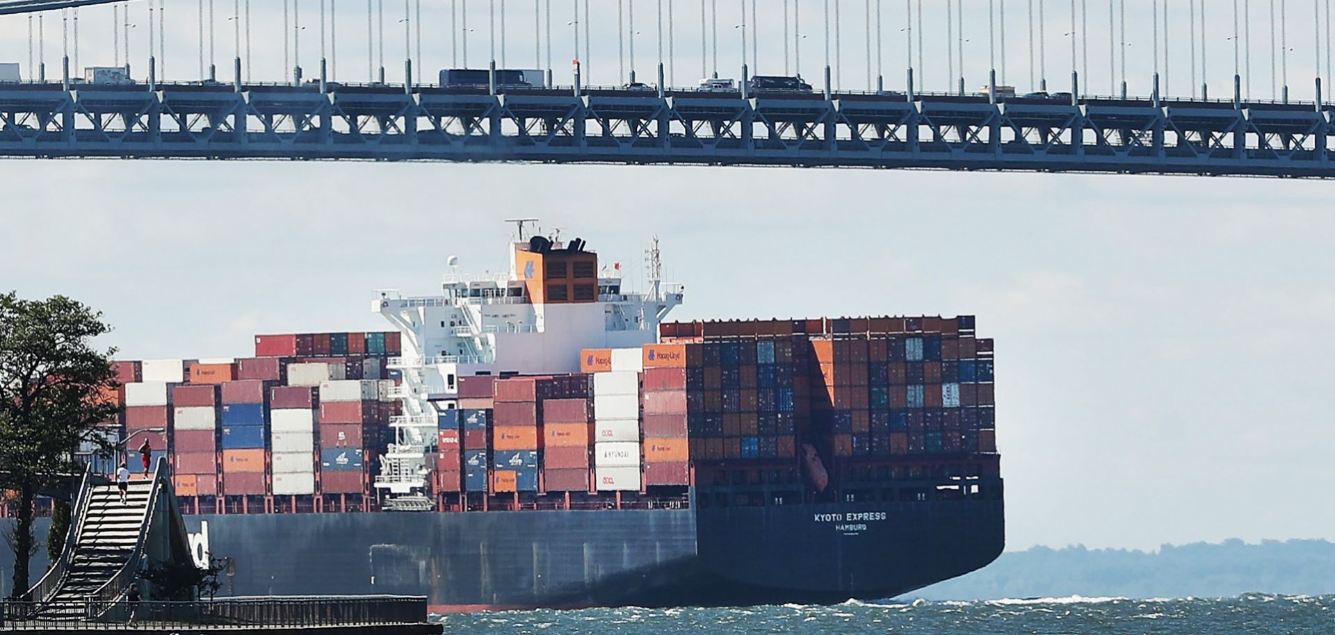 A loaded cargo ship heads out to sea from New York Harbor. Over the past decade, the world's available shipping capacity has grown faster than global trade has.