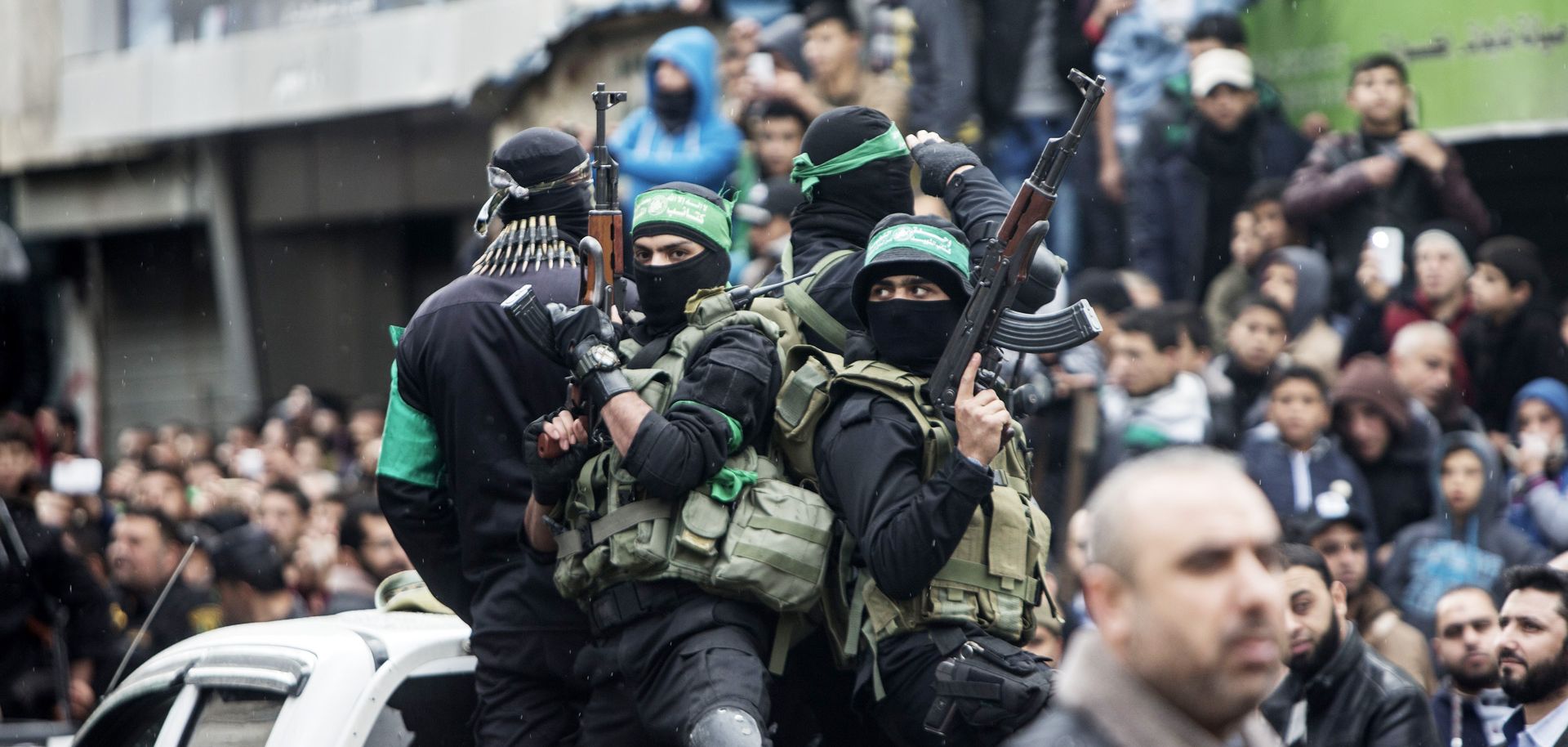 Members of the Izz al-Deen al-Qassam Brigades, Hamas' military wing, take part in a Dec. 14 rally in Gaza City marking Hamas' 29th anniversary. A blockade by Islamic State in the Sinai Peninsula has cut weapons supplies to the Palestinian group.