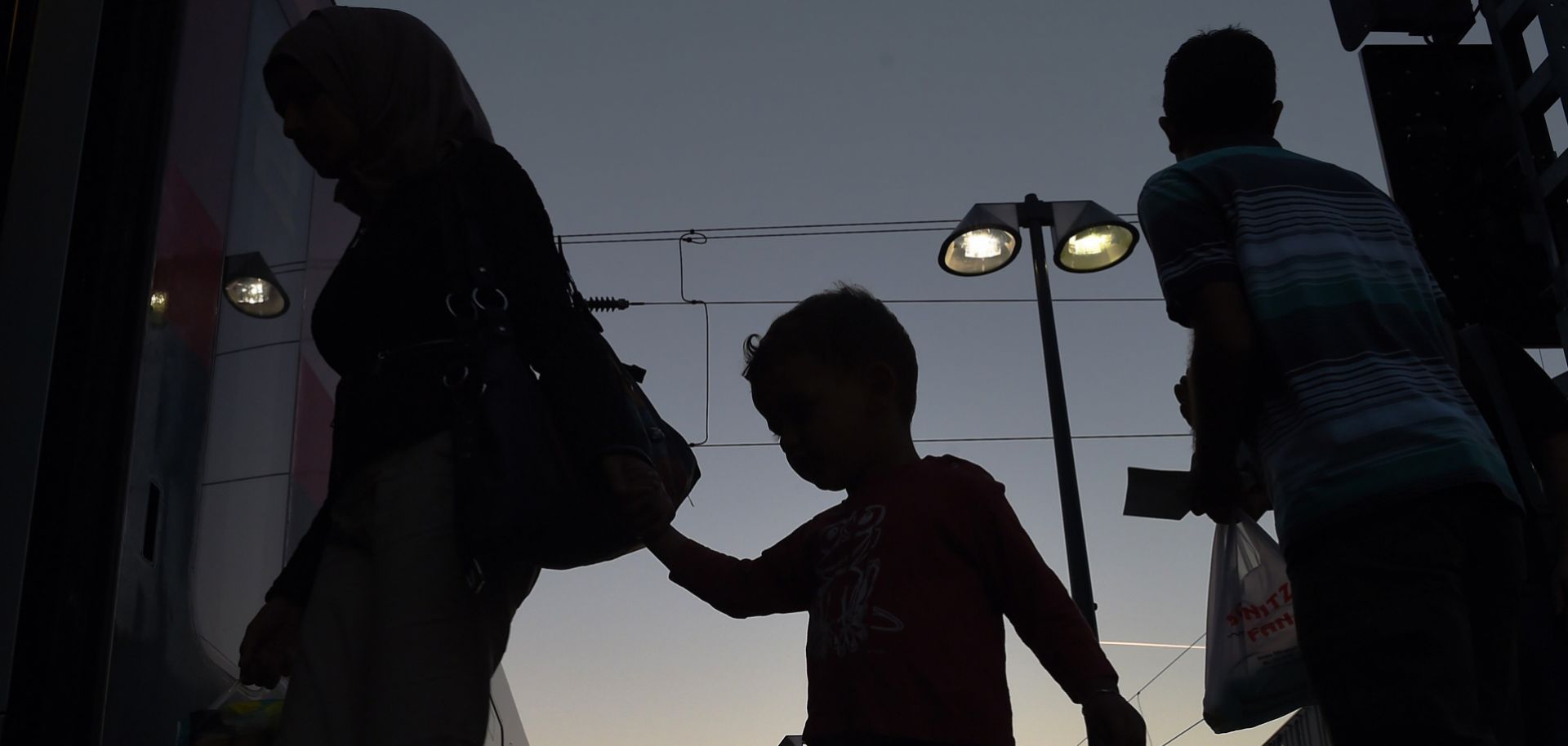 Migrants board a train to Munich at Vienna's Westbahnhof railway station early Sept. 1.