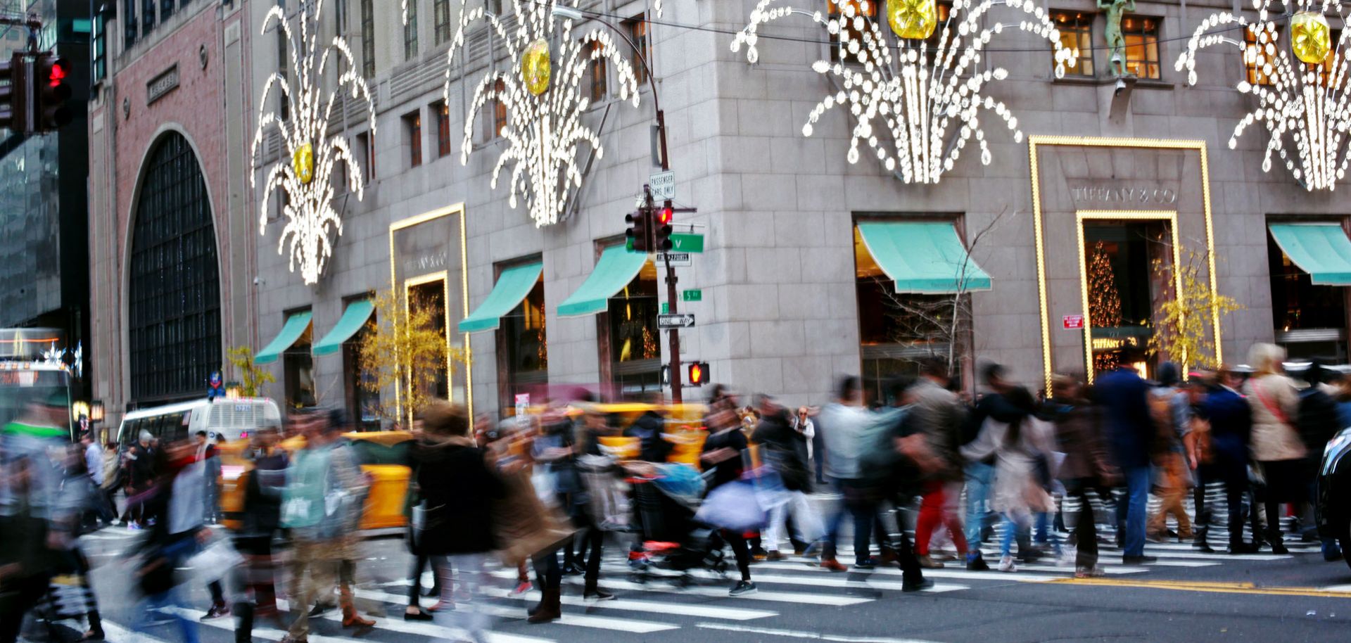 By this time next year, consumers, like these holiday shoppers in New York City, might see the effects of inflation's return. Such signs as stabilizing commodities prices and a bond sell-off point to the return of increasing prices.