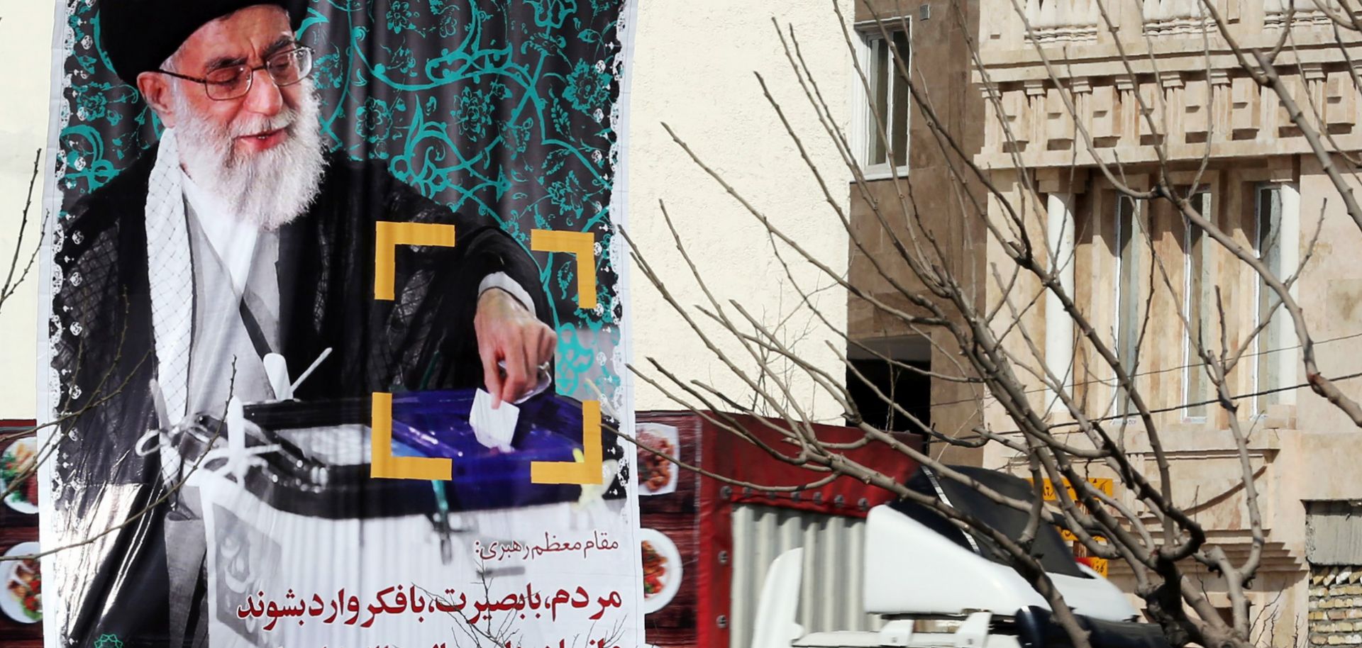 In Tehran, a banner encouraging voter participation depicts Iranian Supreme Leader Ayatollah Ali Khamenei. Moderate, reformist candidates have a chance to perform well in Iran's parliamentary elections Feb. 26.