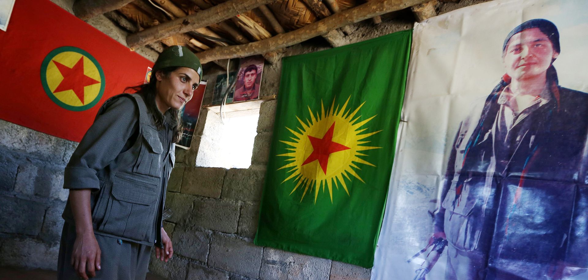A member of the Party of Free Life of Kurdistan (PJAK) at a base in Iraq's Kurdish autonomous region in 2014. Kurdish groups in the Middle East are newly empowered because of the support they received to fight the Islamic State.