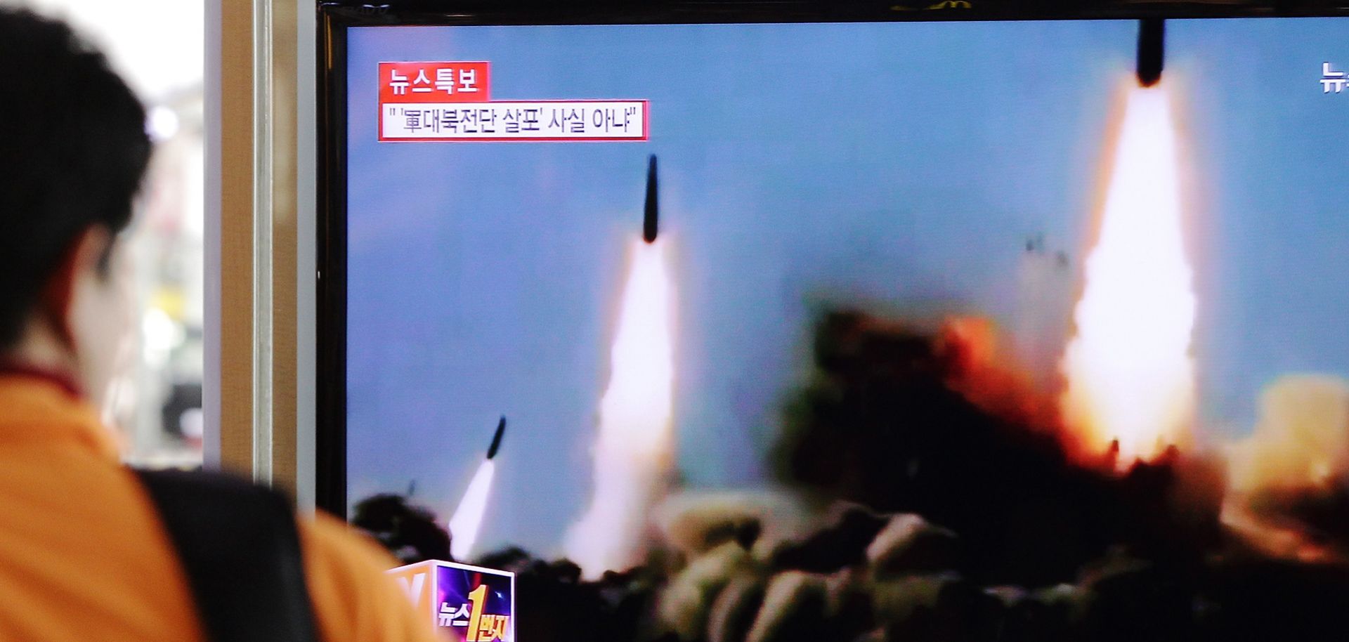 A man watches a report on a North Korean missile launch at the Seoul Railway Station in March 2014 in Seoul, South Korea. (Chung Sung-Jun/Getty Images)