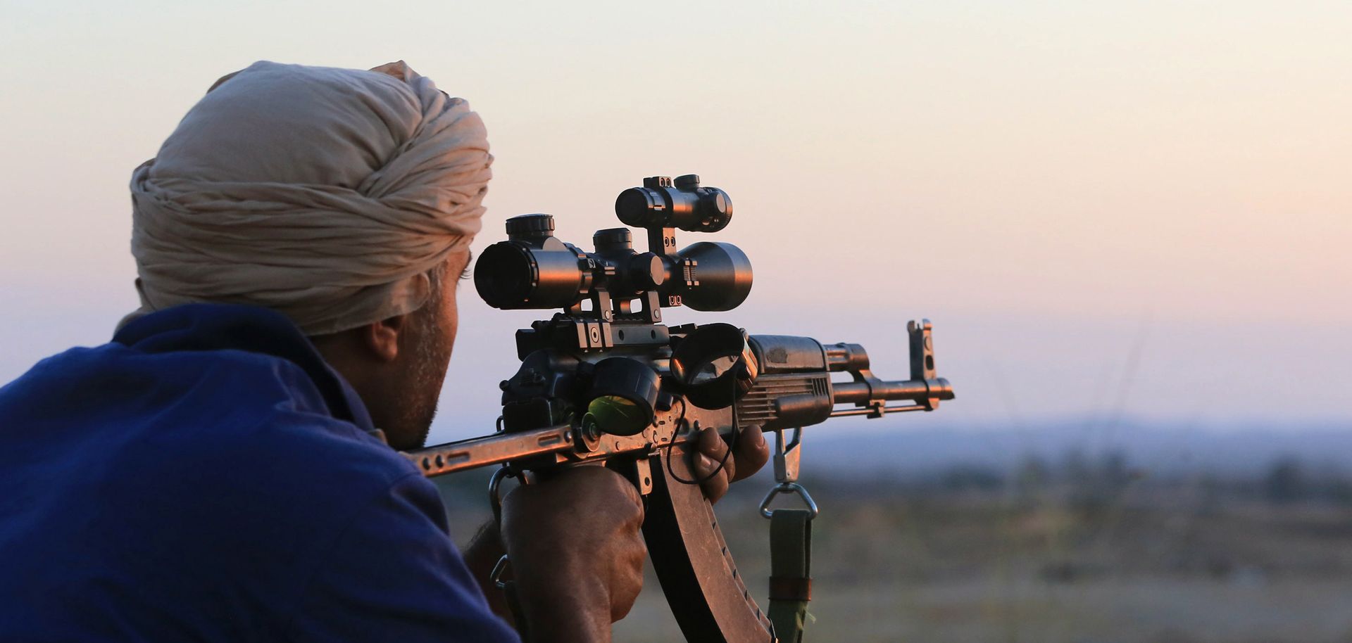 A Libyan Dawn fighter holds his position in Warshefana on Sept. 29.