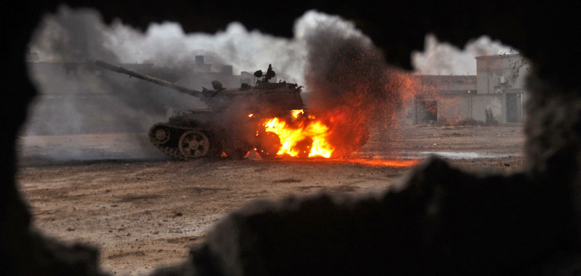 A tank burns as clashes rage between the Libyan National Army, led by Field Marshal Khalifa Hifter, and jihadist militants.