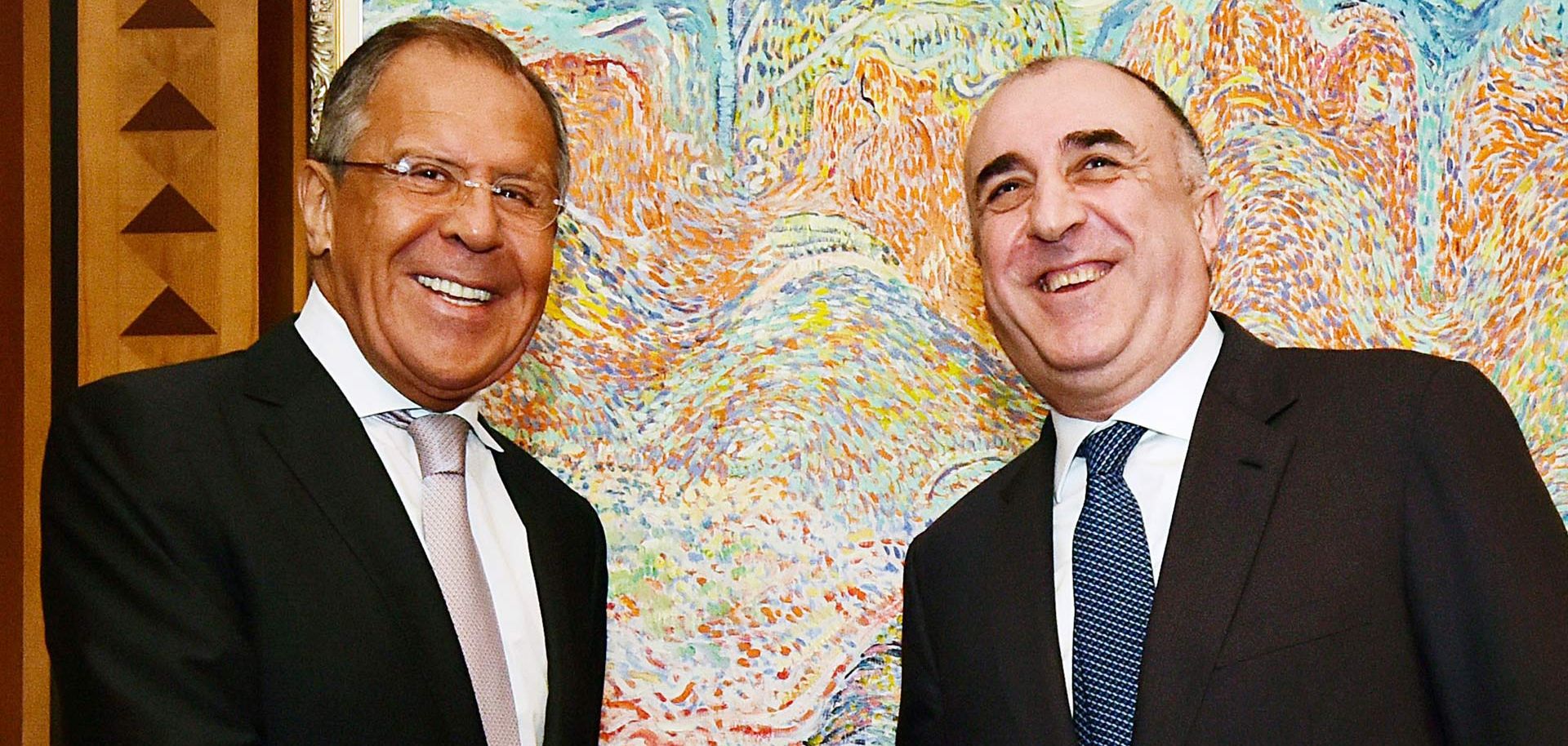 Russian Foreign Minister Sergei Lavrov (L) met with his Azerbaijani counterpart, Elmar Mammadyarov, in Baku on July 12 to discuss the Nagorno-Karabakh dispute. So far, the latest negotiations to resolve the conflict have involved more talk than action.