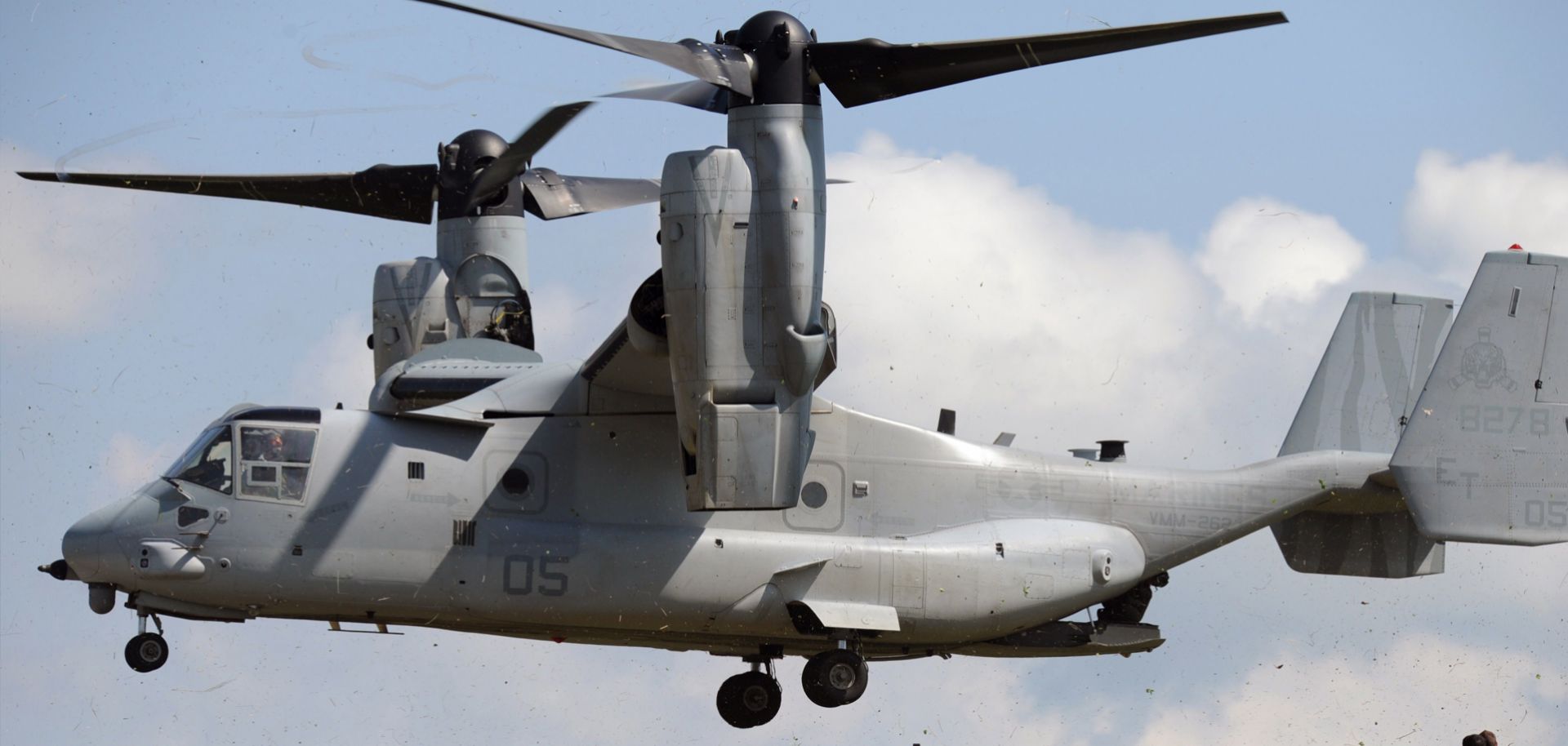 The hallmark of the V-22 Osprey's design is twin tilt rotors suspended at the ends of a central fixed wing.
