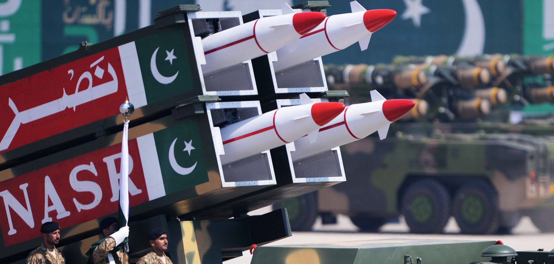 Pakistani military personnel stand beside a low-yield battlefield deterrent short-range surface-to-surface missile during the Pakistan Day military parade in Islamabad.