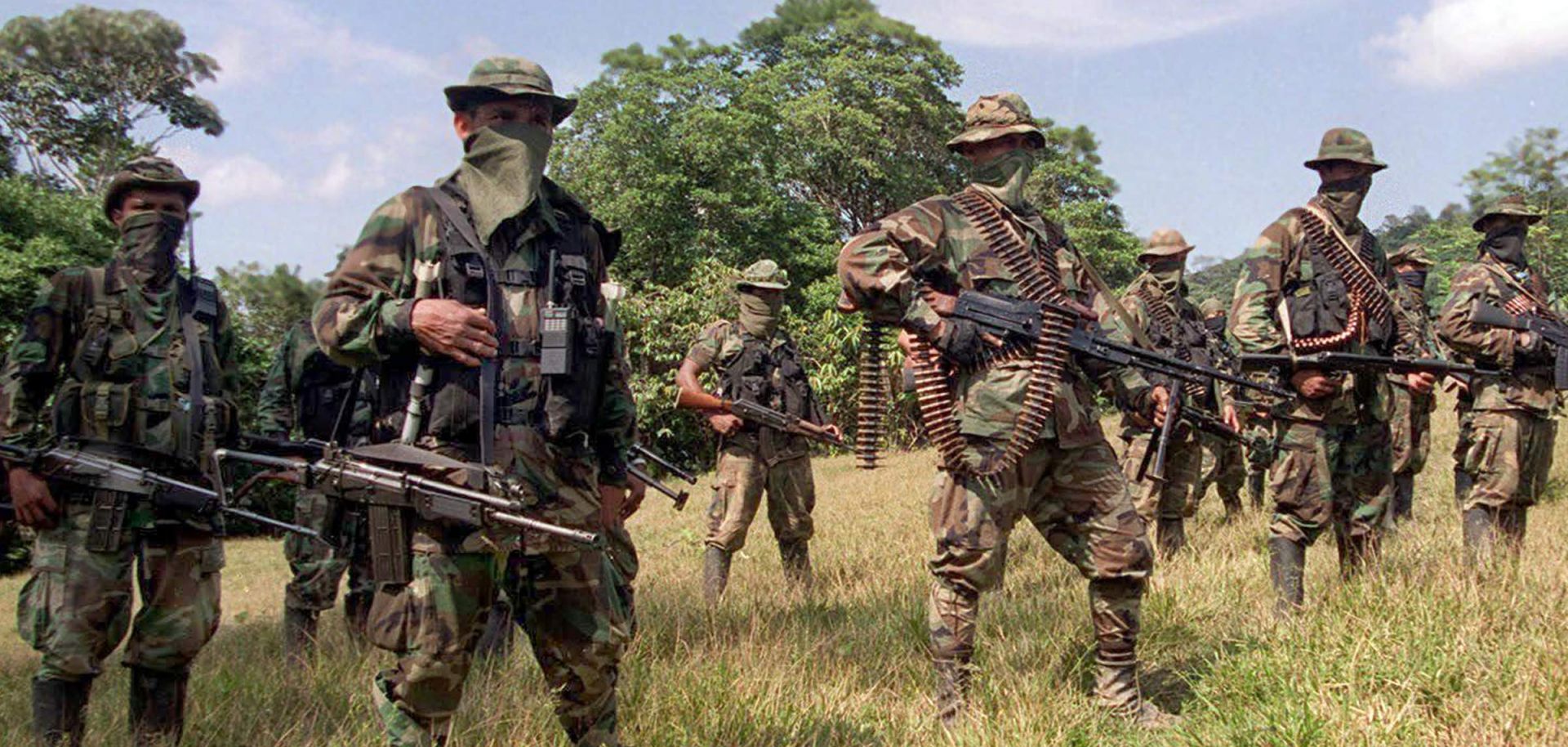 Colombian United Self-Defense Forces (AUC) train Jan. 29, 2000, in the mountains northwest of Bogota. Though the group has officially been disbanded, its parts live on through Colombia's drug trade.