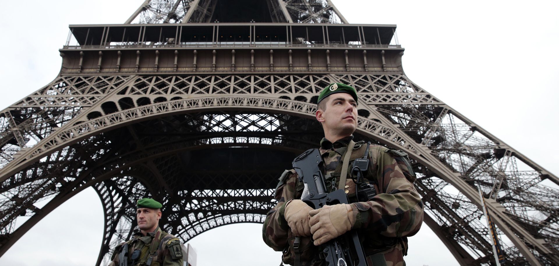French soldiers patrol in front of the Eiffel Tower on Jan. 7, 2015 in Paris.
