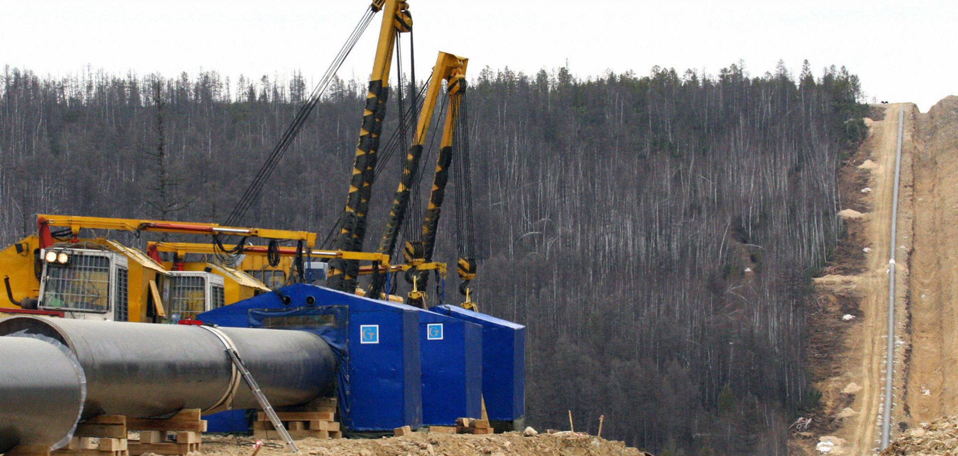 View of pipes and equipment near a trench of the Eastern Siberia-Pacific Ocean oil pipeline in Siberia, Russia.