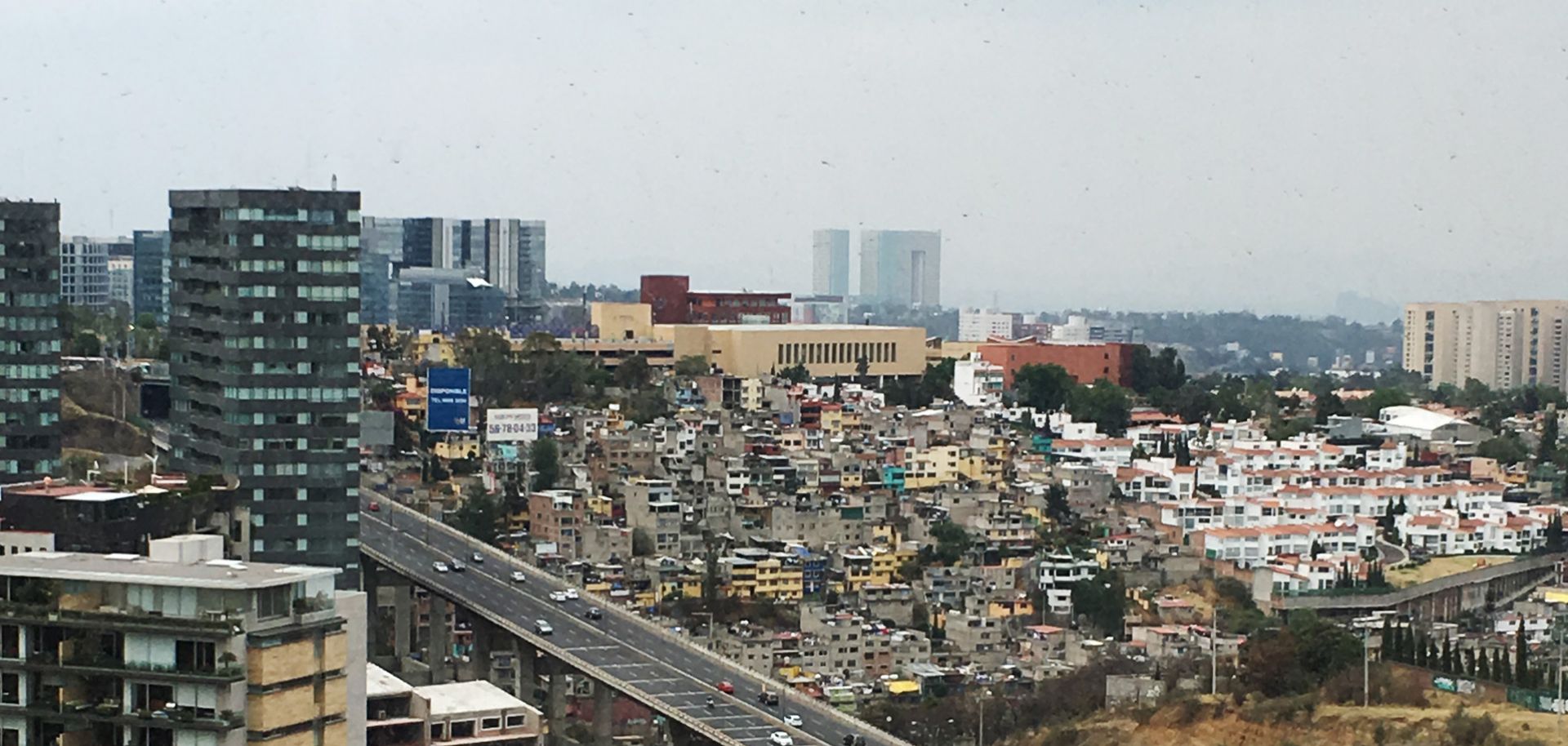 A freeway divides rich and poor sections of Santa Fe, Mexico City. Mexico will be growing in lockstep with the United States, with the potential to join the top 10 economies in the world within a matter of years. But the time has come for Mexico to face its demons.